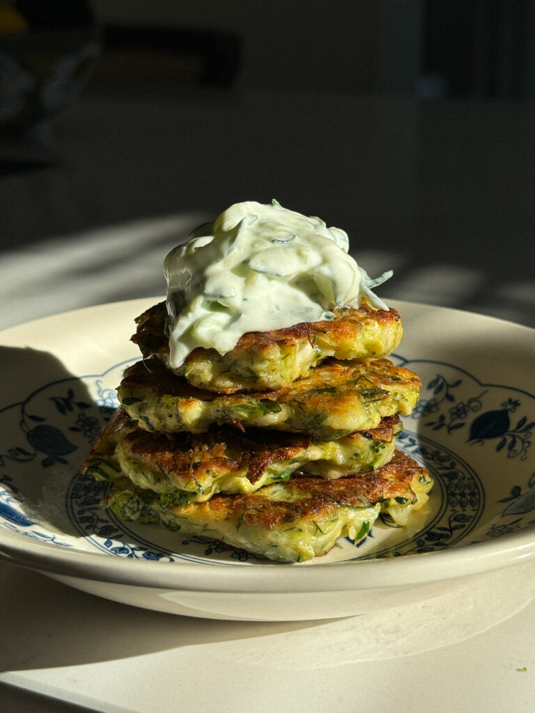 Zucchini/broccoli pancakes with greens and feta